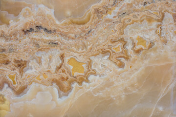 Gold marble pattern with white inclusions. Abstract texture and background