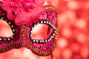 Carnival mask, beautiful carnival mask in detail, with red background, selective focus.