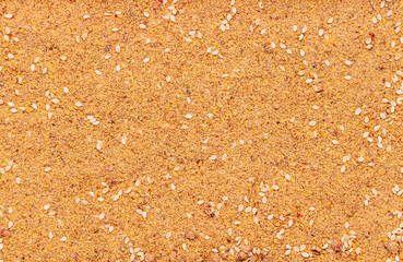 Macro photography of fruity milled linseed mix with sesame seed and dried banana, strawberry, and raspberry powder; natural dietary fiber 