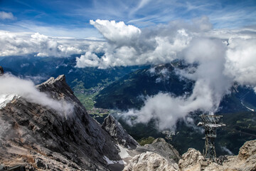 A mountain range with clouds in the sky view of the alps from zugspitze mountain in Germany mountains