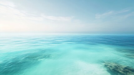 Obraz premium The clear turquoise ocean stretches towards the horizon under a blue sky