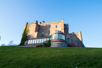 Dalhousie castle hotel in Bonnyrigg, Midlothian, Scotland. Photo of the castle from the back with restaurant anex.