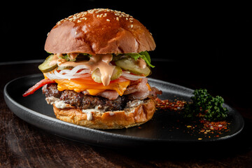 A delicious gourmet burger with a sesame seed bun, juicy beef patty, melted cheese, fresh...