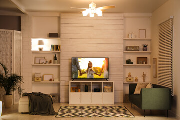 Movie playing on TV set in room