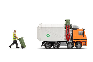 Female waste collector pulliung a bin and walking towards a garbage truck