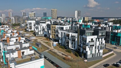 Panoramic view of a newly built new high-rise residential block in the city. Construction of mass housing. Urbanisation. Resettlement of population from rural areas to cities.