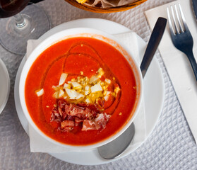 Cordoban salmorejo with ham and egg shavings is a traditional Spanish cold tomato soup.