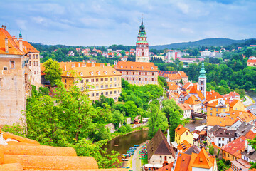 Summer cityscape - top view of the Old Town of Cesky Krumlov and the Vltava river flowing through it, Czech Republic