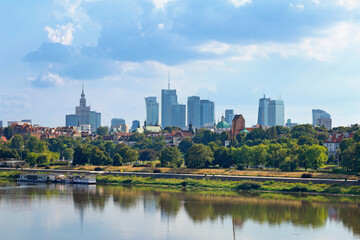 Naklejka premium Cityscape - view of the district of Srodmiescie in the center Warsaw, view from the Vistula River, Poland