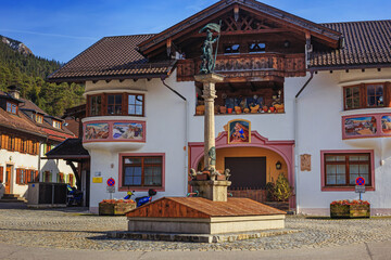 Cityscape - view of the statuary fountain of St. Florian in the alpine ski town of Garmisch-Partenkirchen, in Upper Bavaria, Germany