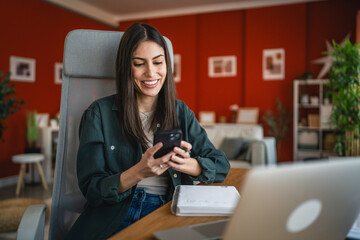 Adult woman at home office use mobile phone and smile enjoy at break