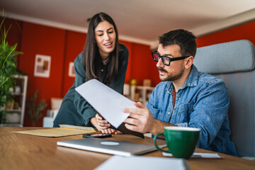 two colleagues analysis and research together results from clipboard