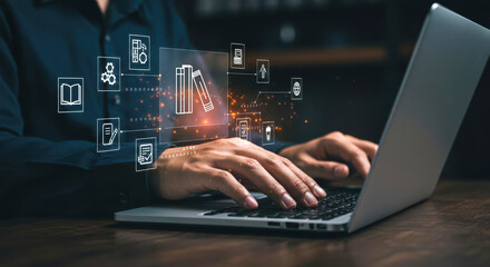 Obraz premium Businessman using laptop with virtual education and knowledge management system