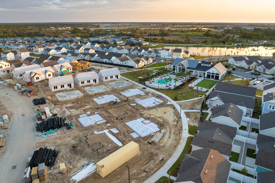 Development of residential housing in the USA. Wooden frames of new cheap American homes under construction