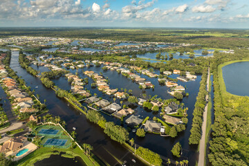 Flooding in Florida caused by tropical storm from hurricane Debby. Suburb houses in Laurel Meadows residential community surrounded by flood waters in Sarasota. Aftermath of natural disaster