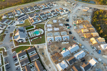 Fototapeta premium Houses under construction in American suburbs. Development of residential housing. Real estate market in the USA