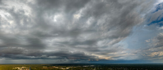 Rainstorm shower in Florida in humid summer season. Rain water pouring down from stormy clouds
