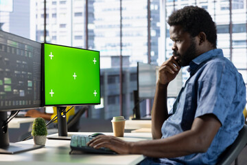 Programmer conducting tests on isolated screen computer to optimize machine learning models for...