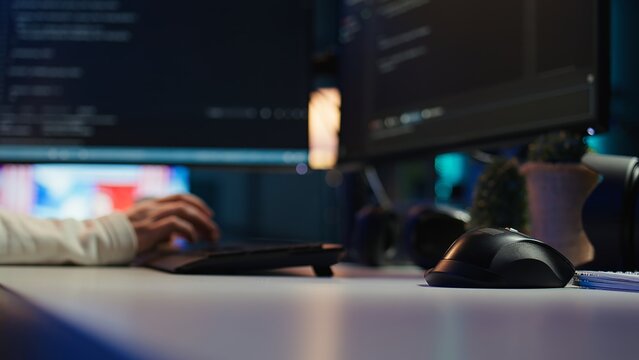Computer technician working from home, designing and developing software applications, close up. IT specialist typing on PC keyboard, implementing and maintaining company systems, camera B