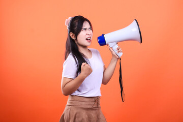 A woman with a megaphone against orange background is making an announcement