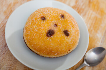Delicious german donut Berliner made with chocolate filling and sugar on top