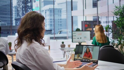 Obraz premium Human resources worker conducting a job interview via online videocall, using remote internet telecommunication to look for talented personnel. Employee interviewing woman on conference. Camera B.