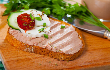 Bruschetta with meat pate, mozzarella, cucumber and herbs