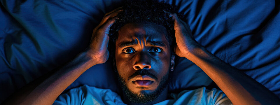 A man with a midlife crisis, suffers from insomnia and thoughts of failure in life, showing anxiety, fear and stress. The concept of midlife crisis.