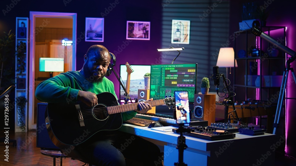 Leinwandbilder professional composer teaching guitar lessons online on master class, recording himself playing acou