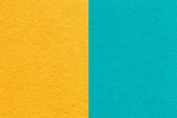 Fototapeta premium Texture craft yellow and turquoise paper background, half two colors, macro. Structure vintage blue cardboard.