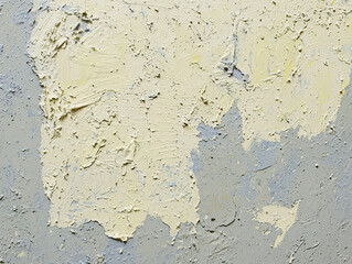 Abstract painting with thick, textured yellow and grey brushstrokes. Close-up view.