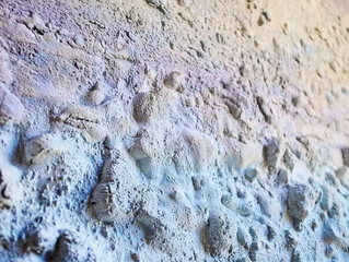 Close-up image of a textured gray and white wall.
