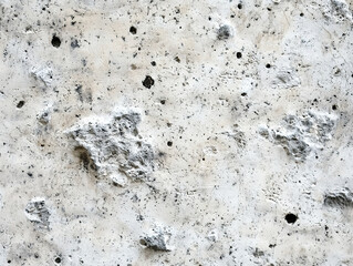Close-up image of a textured stone wall surface.