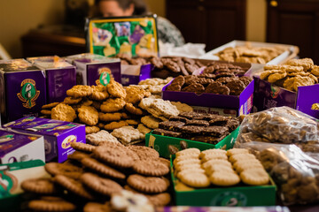 Nostalgic Display of Girl Scout Cookies with Vintage Sash