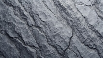 Naklejka premium Grey granite texture with natural, rugged patterns and grooves.