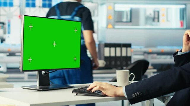 Photovoltaics factory worker analyzing data on green screen PC, reviewing system metrics. Solar panels manufacturing plant employee troubleshooting technical issues using chroma key computer, camera B