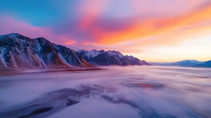 Sunset over snowy mountains nature landscape dreamy viewpoint serene environment