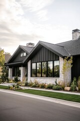 Modern residential house with a blend of stone and wood, surrounded by landscaped garden and spacious front yard in a serene neighborhood during early morning light