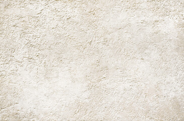 Fototapeta premium Champagne gold plastered wall background for design. Modern concrete wall texture.
