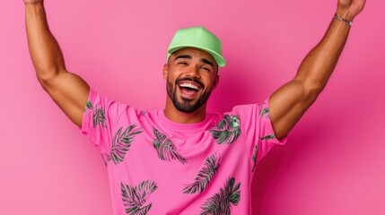 Naklejka premium Joyful Enthusiastic Man Celebrating with Raised Arms on Vibrant Pink Background Cheerful Positive Expression of Happiness and Excitement