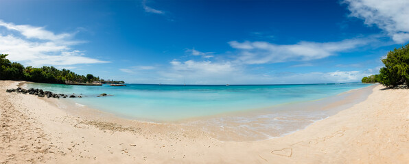 Tobago beach front panorama I love heart sign written sand