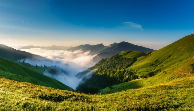 Fog and ocean of clouds in the mountain valley; highlands and low lying clouds in the mountainous valley with blue skies; beautiful landscapes; dramatic scenery