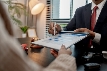 a lawyer is explaining the details of a car insurance policy to the car owner before she signs it, a lawyer explains to his client what will happen if she doesn't get car insurance