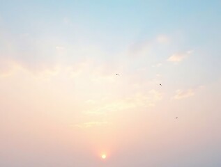 Soft pastel morning sky with a gentle gradient of warm peach and cool blue hues, featuring a glowing sun near the horizon and a few birds soaring in the distance, evoking a tranquil and dreamy atmosph