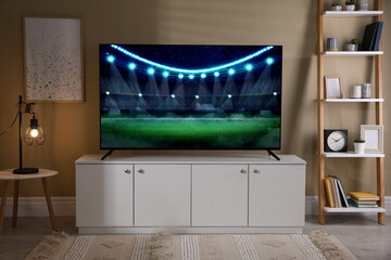 Sport game playing on TV set in room
