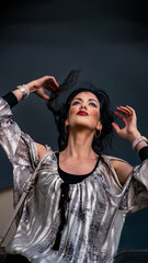 Dramatic portrait of a young woman in front of the storm, but in a fashionable way
