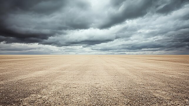 Vast Tan Desert Landscape Under a Dramatic Stormy Sky