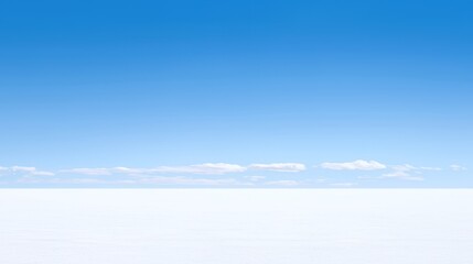 Vast White Salt Flat Under a Clear Blue Sky