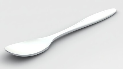 A sleek, modern white spoon resting on a light gray surface, showcasing its elegant design