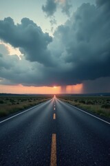 Naklejka premium A Long, Straight Asphalt Road Leads to a Sunset Underneath a Dramatic, Dark Cloud Formation